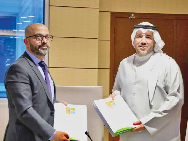 الأحمد وديماسي عقب توقيع الاتفاقية 