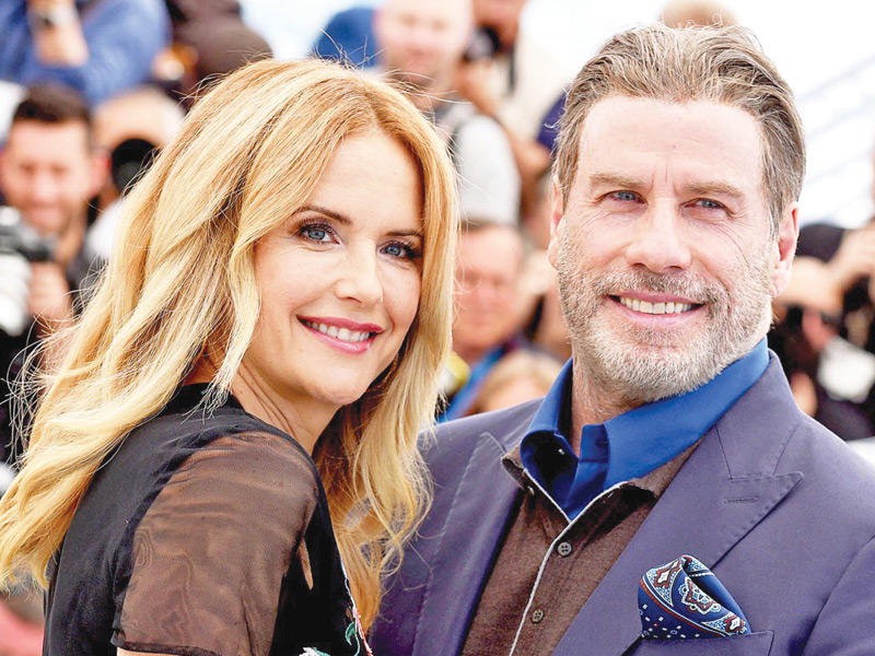  النجم العالمي ​جون ترافولتا​ مع زوجته الممثلة الأميركية الراحلة ​كيلي بريستون