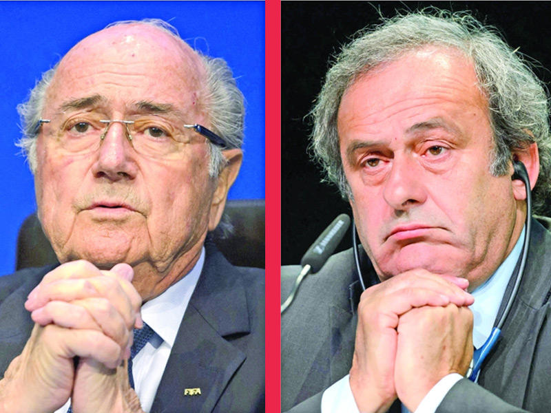 الرئيس السابق للاتحاد الأوروبي (يويفا) الفرنسي ميشال بلاتيني -  والرئيس السابق للاتحاد الدولي لكرة القدم (فيفا) السويسري جوزيف بلاتر 